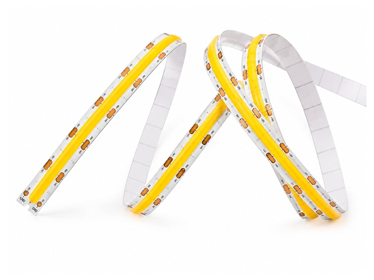 bed-led-strip-component-01 - Custom LED Lighting & OEM LED Modules Supplier Flexible LED strip lights in white and yellow, coiled in a looping shape with printed measurement markings on each segment (assorted sections).
