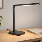 Black LED desk lamp with a flat base, adjustable head, and rear power cord
