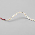 Complete white PCB SMD LED strip sample with consistent cut marks and protected two-wire connector
