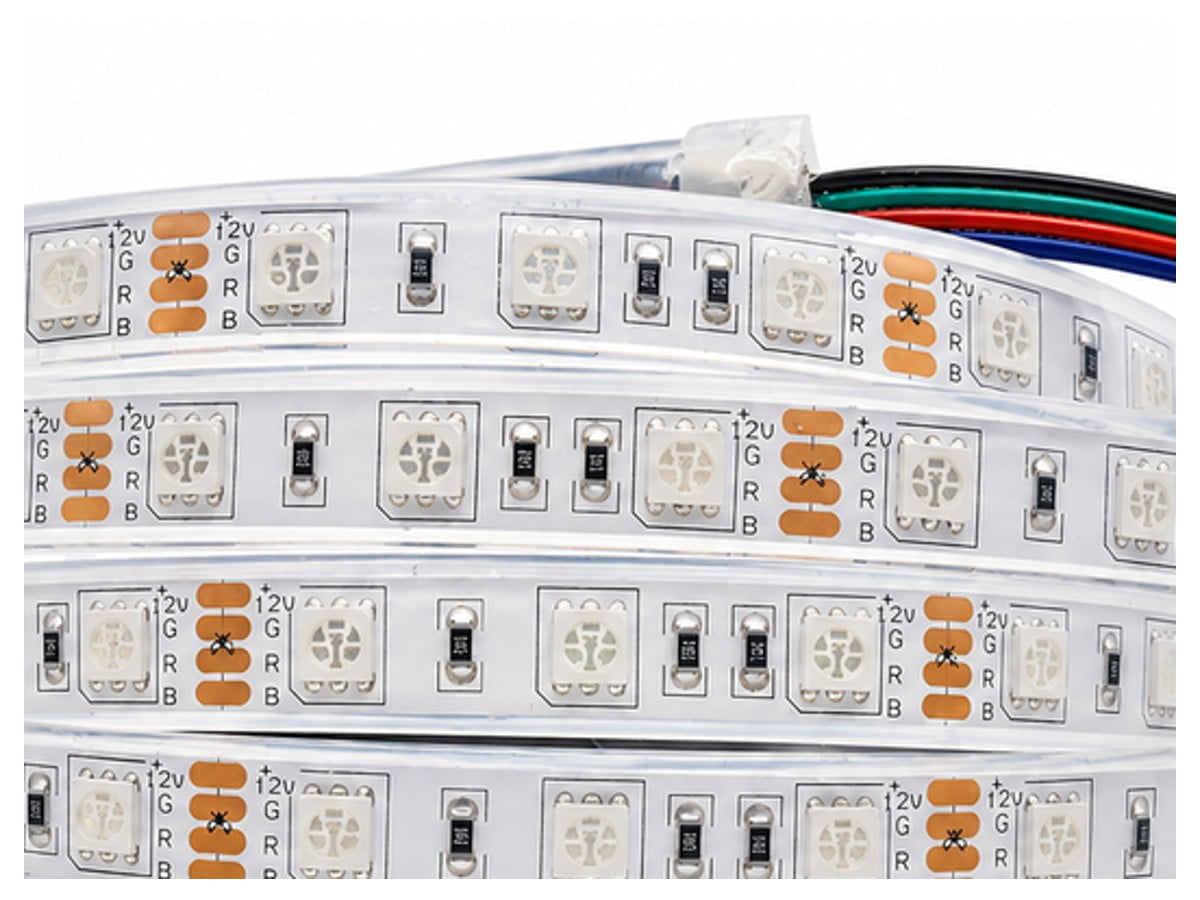 Rolled-up flexible LED strip lights with 12V RGB markings and small surface LEDs.