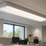 Linear lamp within the optical assembly that shapes its delivered light