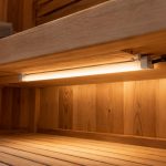 Sauna LED lights concept installed beneath a wooden bench